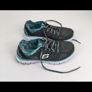 Sketchers women’s black & green trim gym shoes.